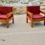 Pair of pine fireside chairs, France, 1960s, "raspberry" cushions