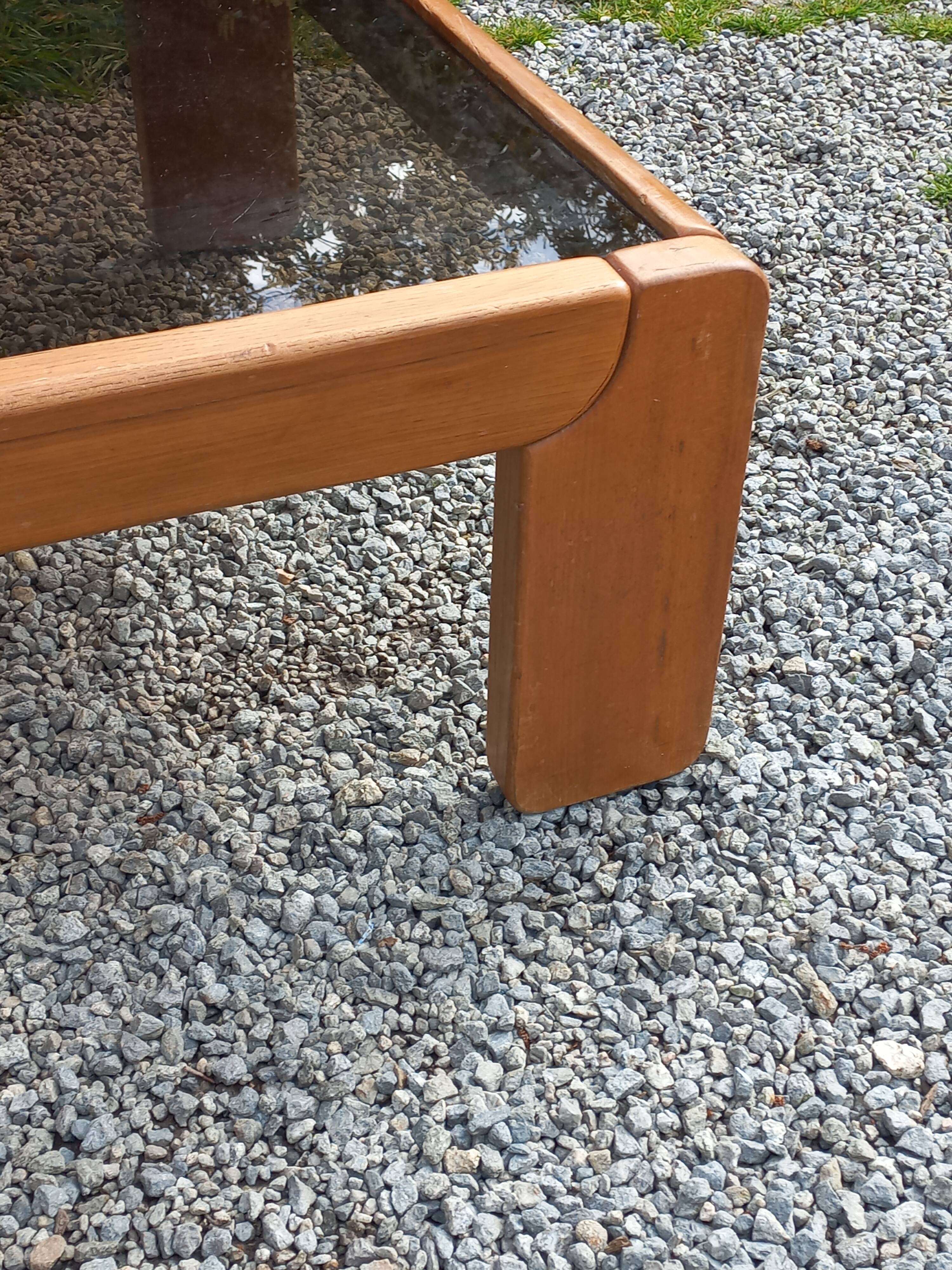 Coffee table from Regain in solid elm with a smoked glass top.