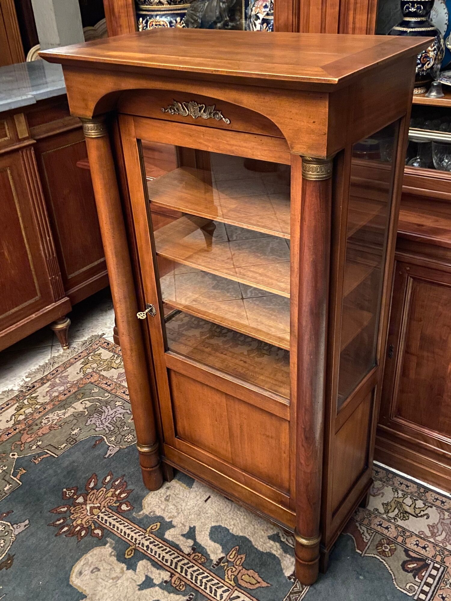 Empire style display case in cherry wood