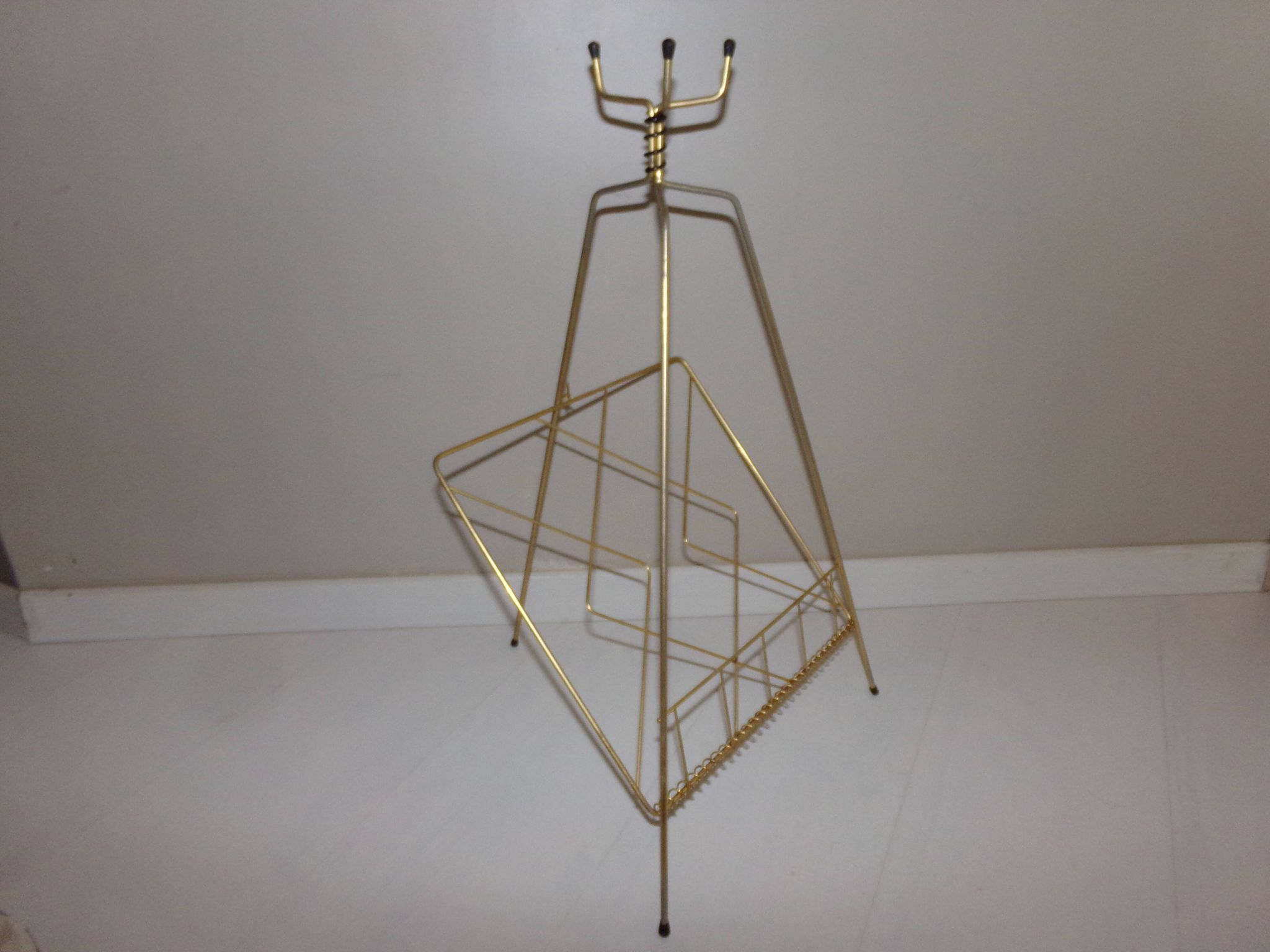 Vintage magazine holder in gold metal