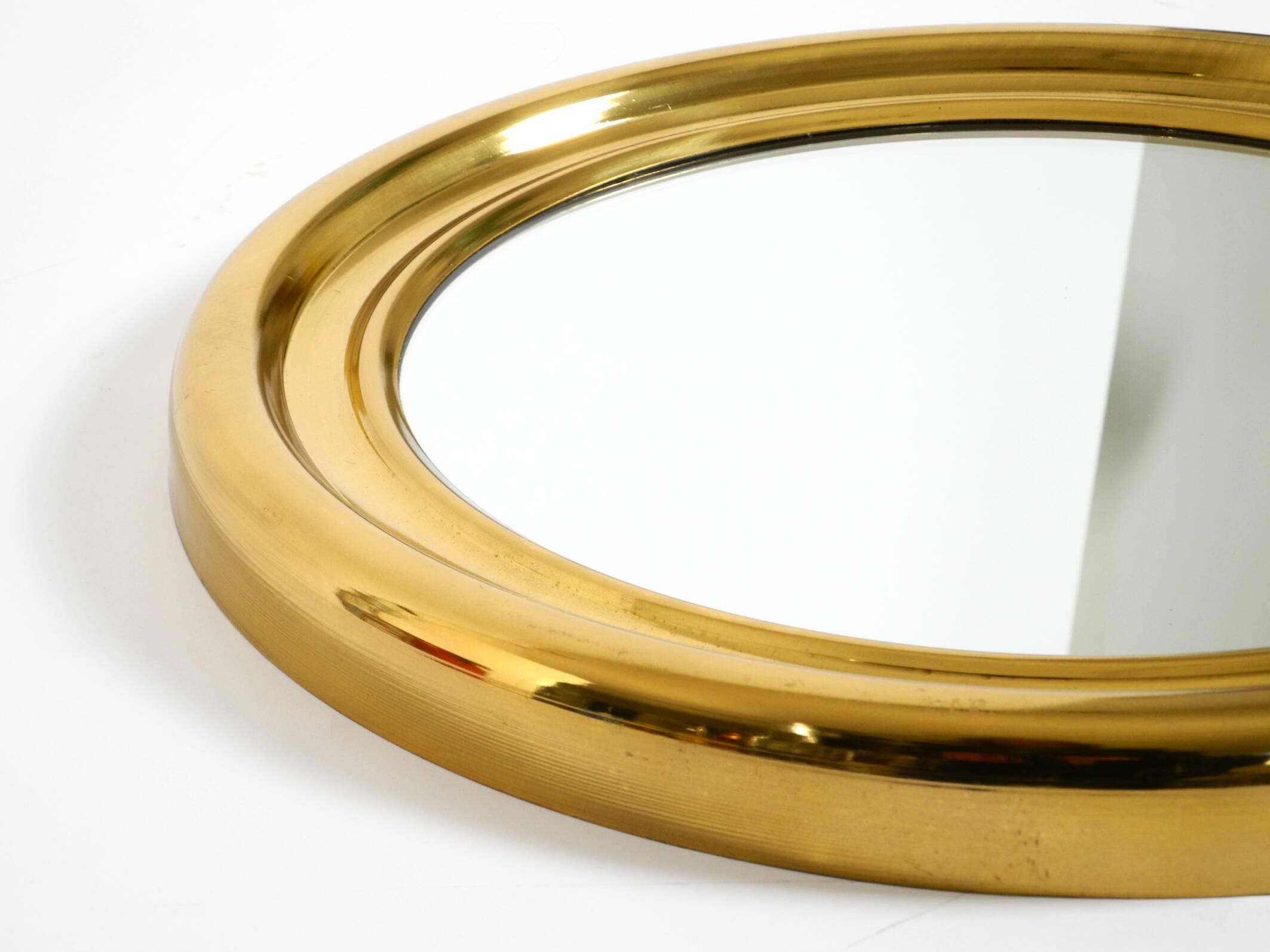Beautiful, heavy, round Italian brass mirror from the 1960s