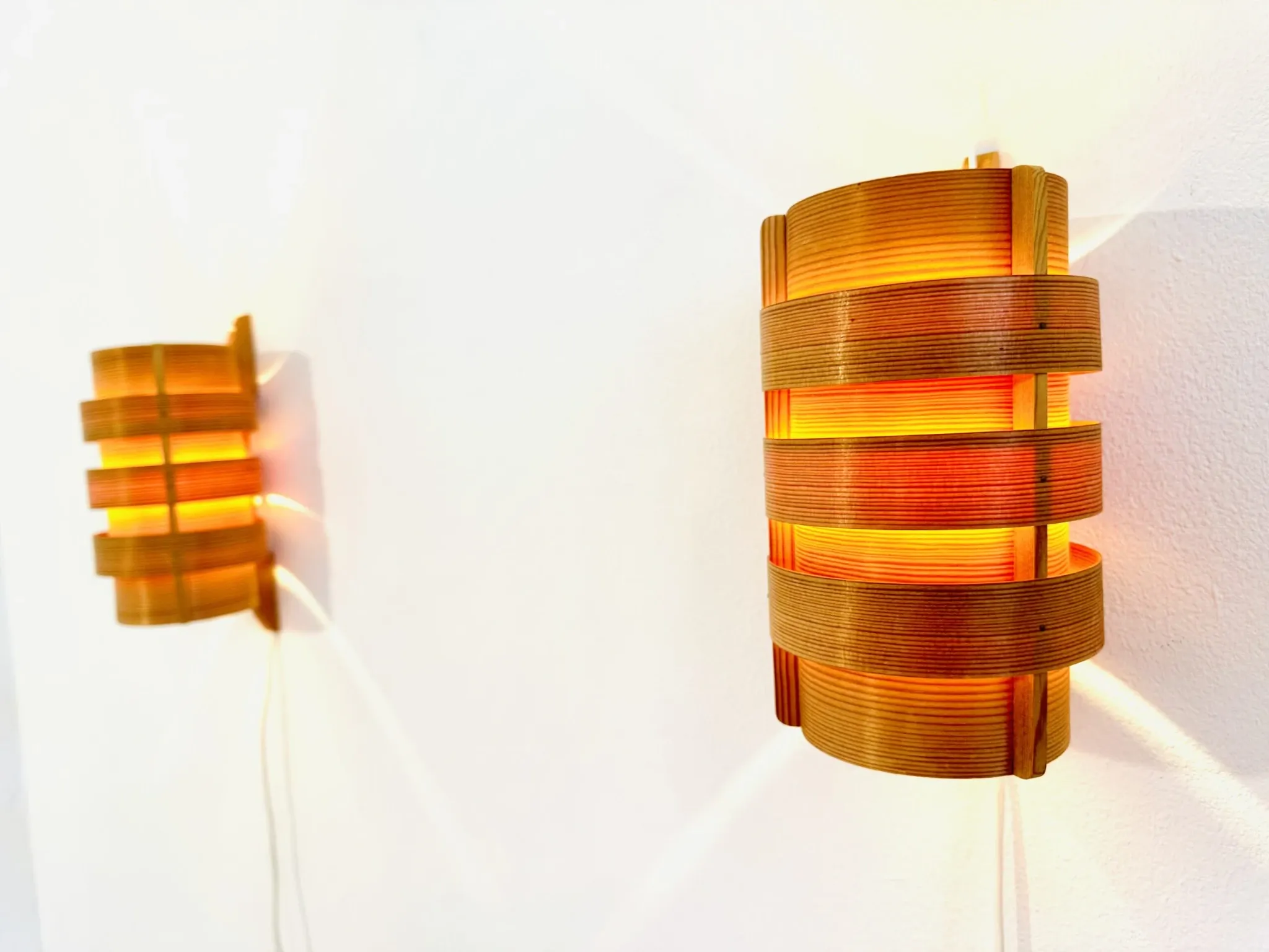 Wall sconces in pine veneer by Hans-Agne Jakobsson for Ab Ellysett, Sweden, 1960s.