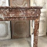 Red marble fireplace in the Louis XVI style, late 19th century