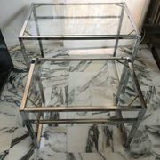 Nested tables in chrome metal and glass, Italy circa 1970.