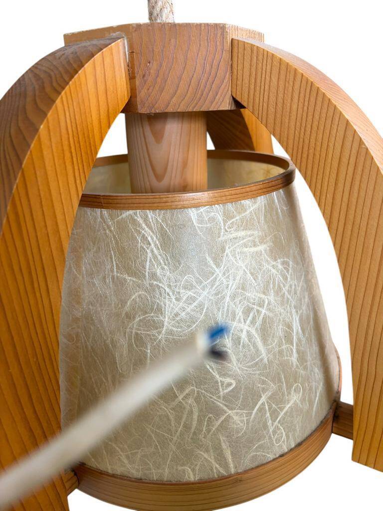 Vintage wooden wall lamp with rope detail.