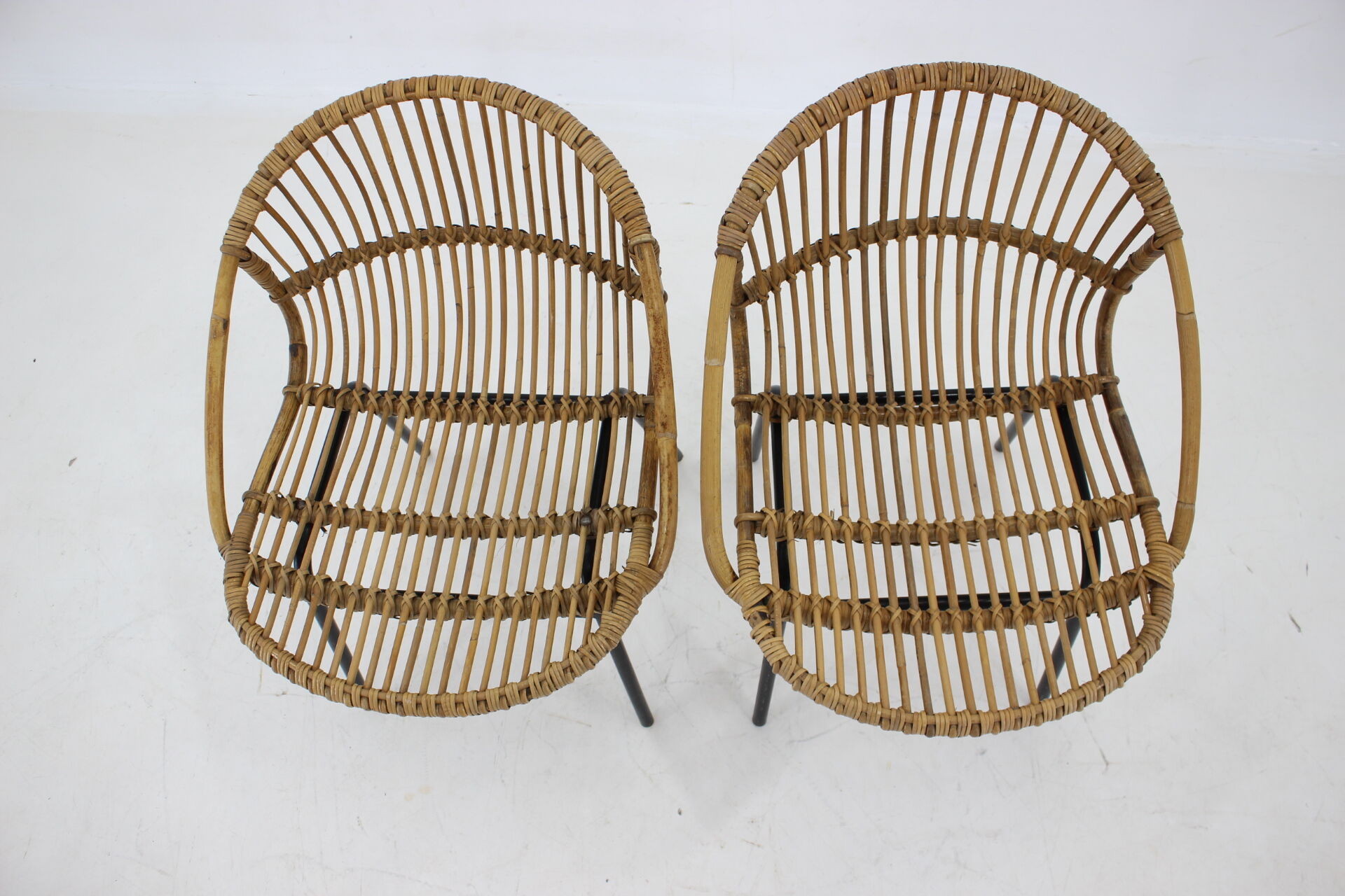 1970s pair of Alan Fuchs rattan and iron lounge chairs, Czechoslovakia