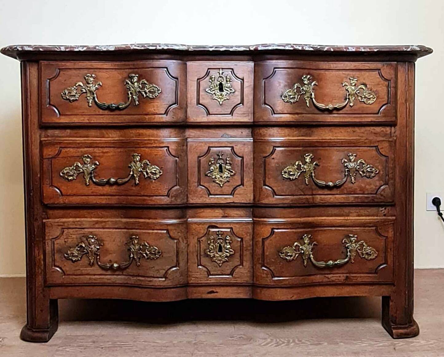 Louis XIV period Arbalette chest of drawers in solid walnut circa 1700