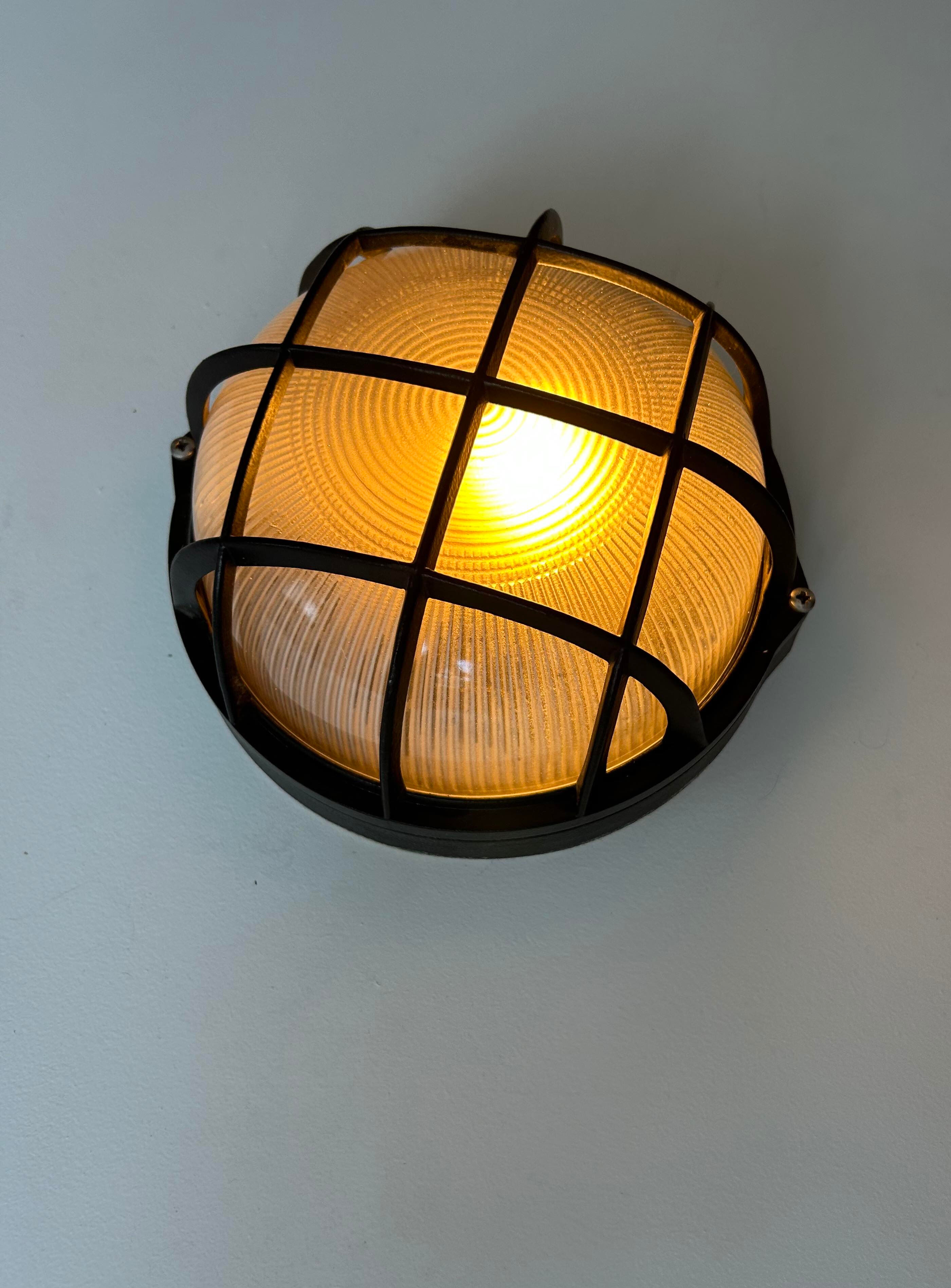 Vintage wall lamp, black metal and ridged glass, France 1980.