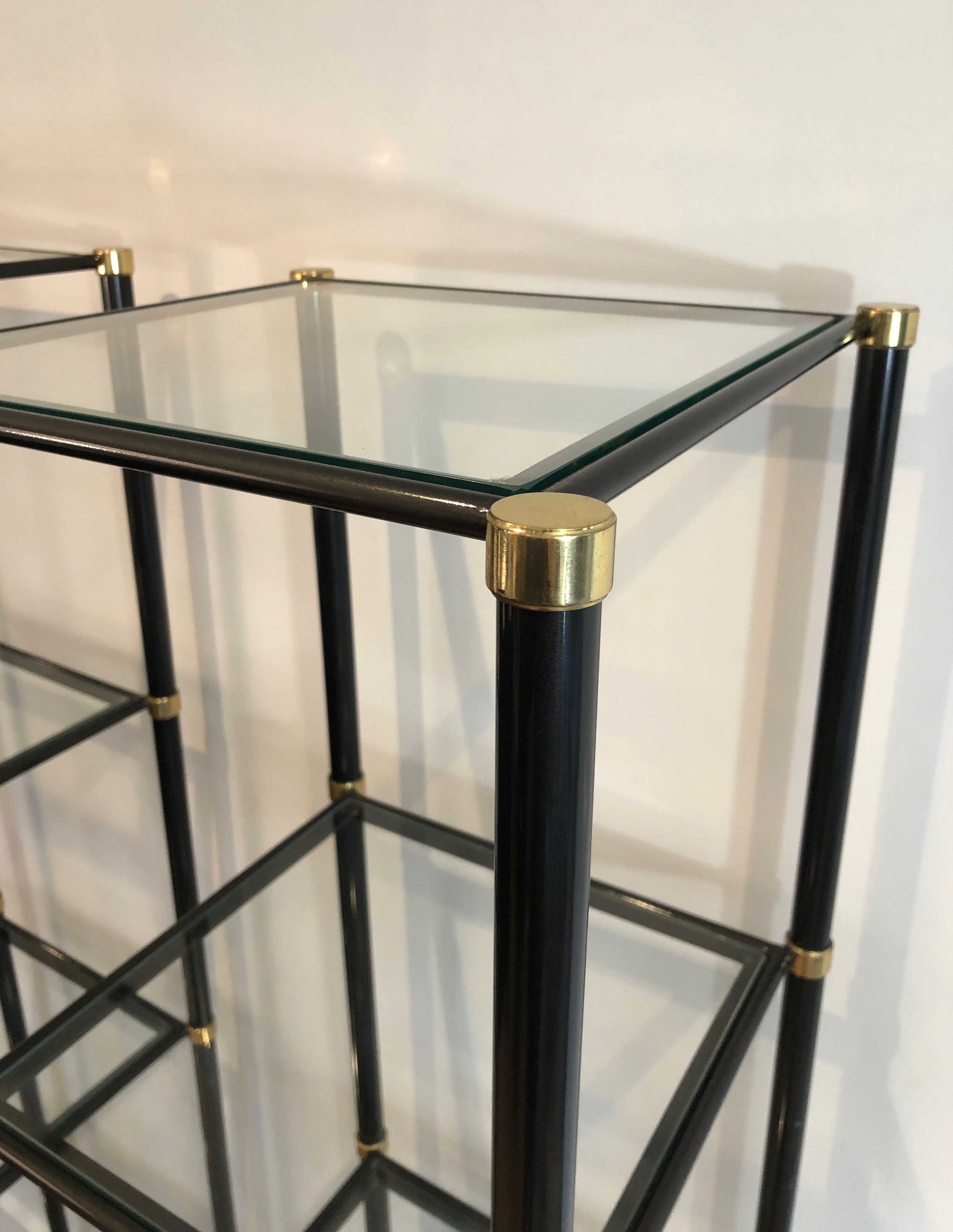 Pair of black lacquered metal and brass shelves. Guy Lefèvre for Maison Jansen. Circa 1970.