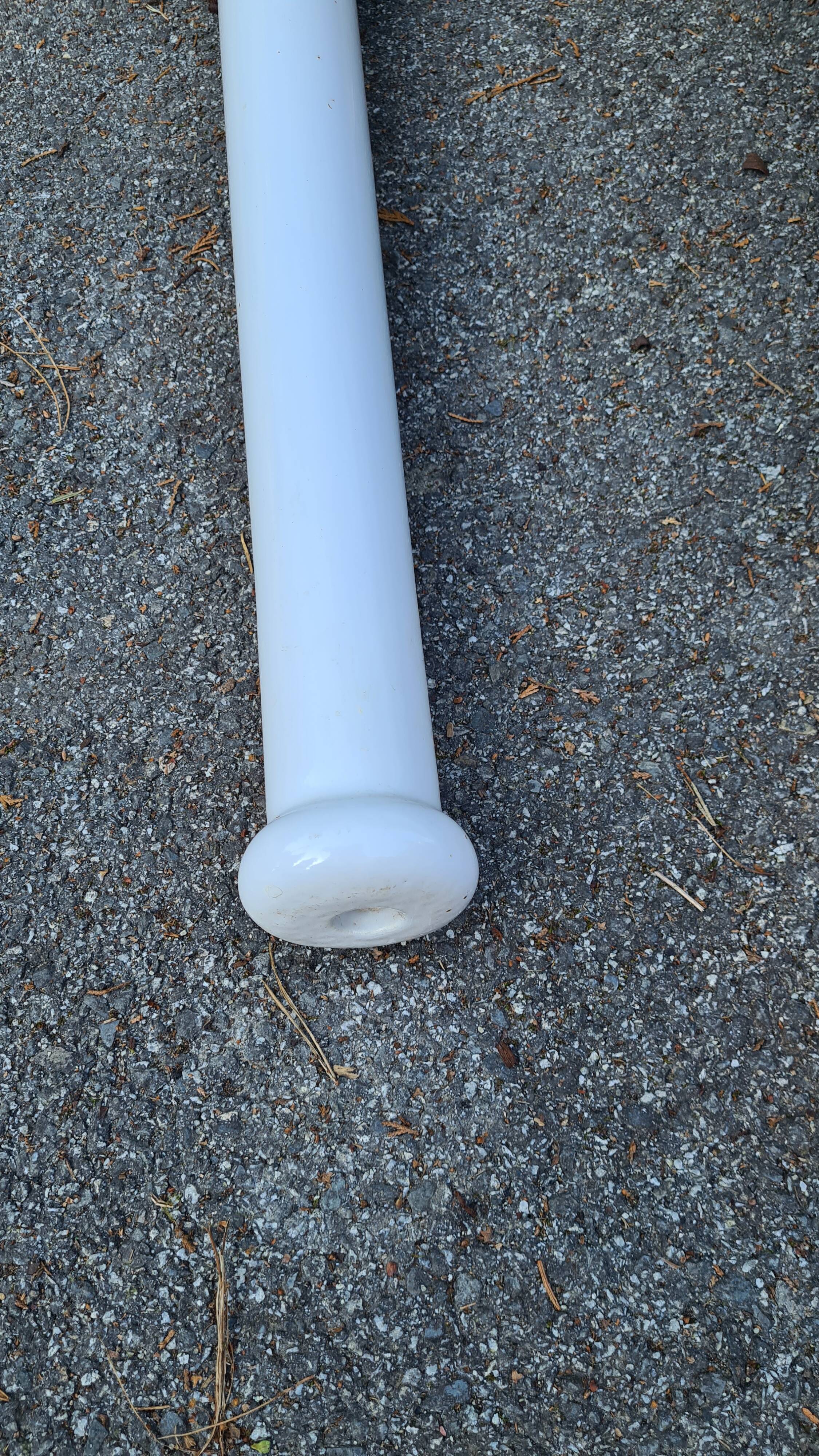 White ceramic wall washbasin with 2 ceramic legs