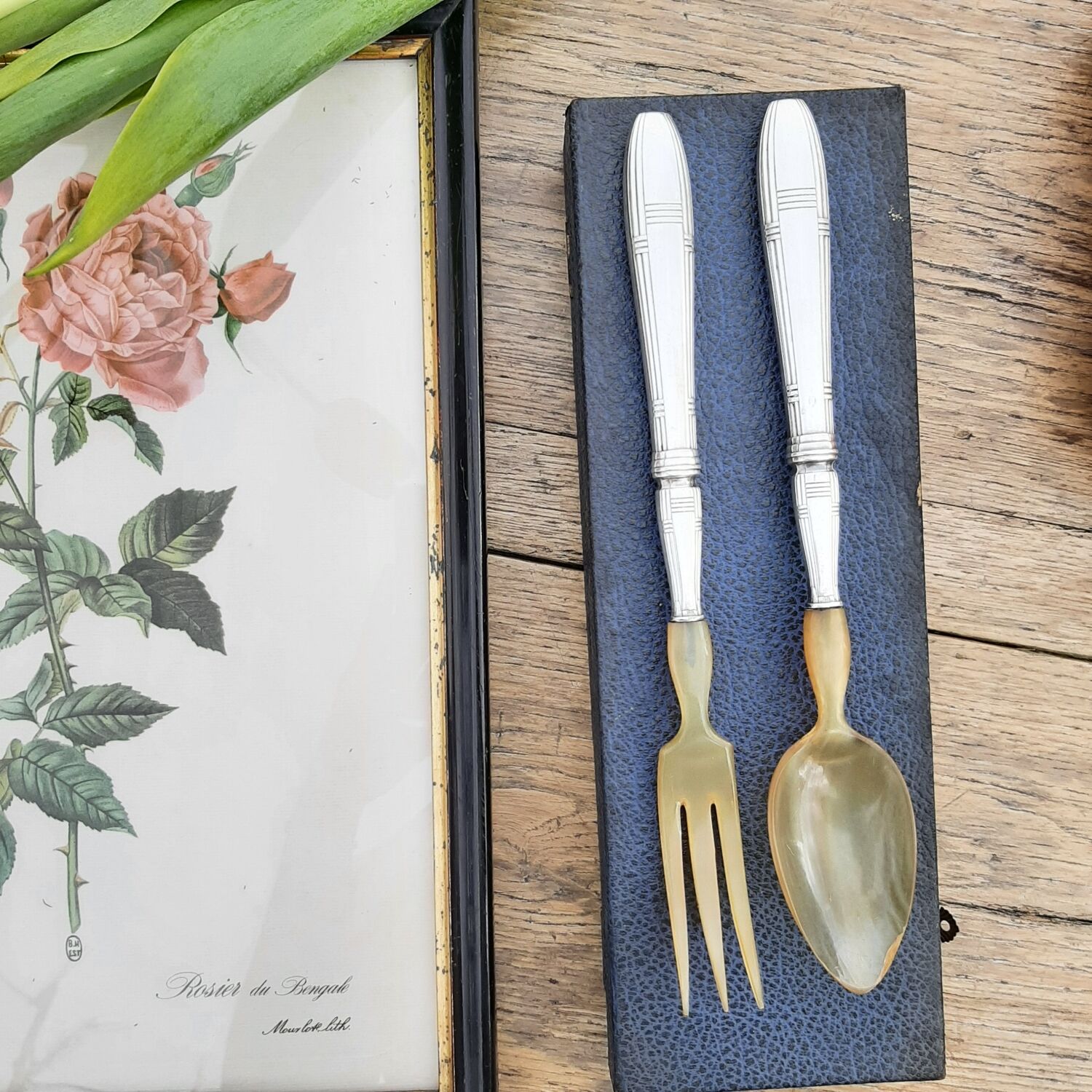 Corn and silver metal salad cutlery