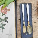 Corn and silver metal salad cutlery