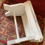 Patinated wooden footrest.