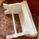 Patinated wooden footrest.