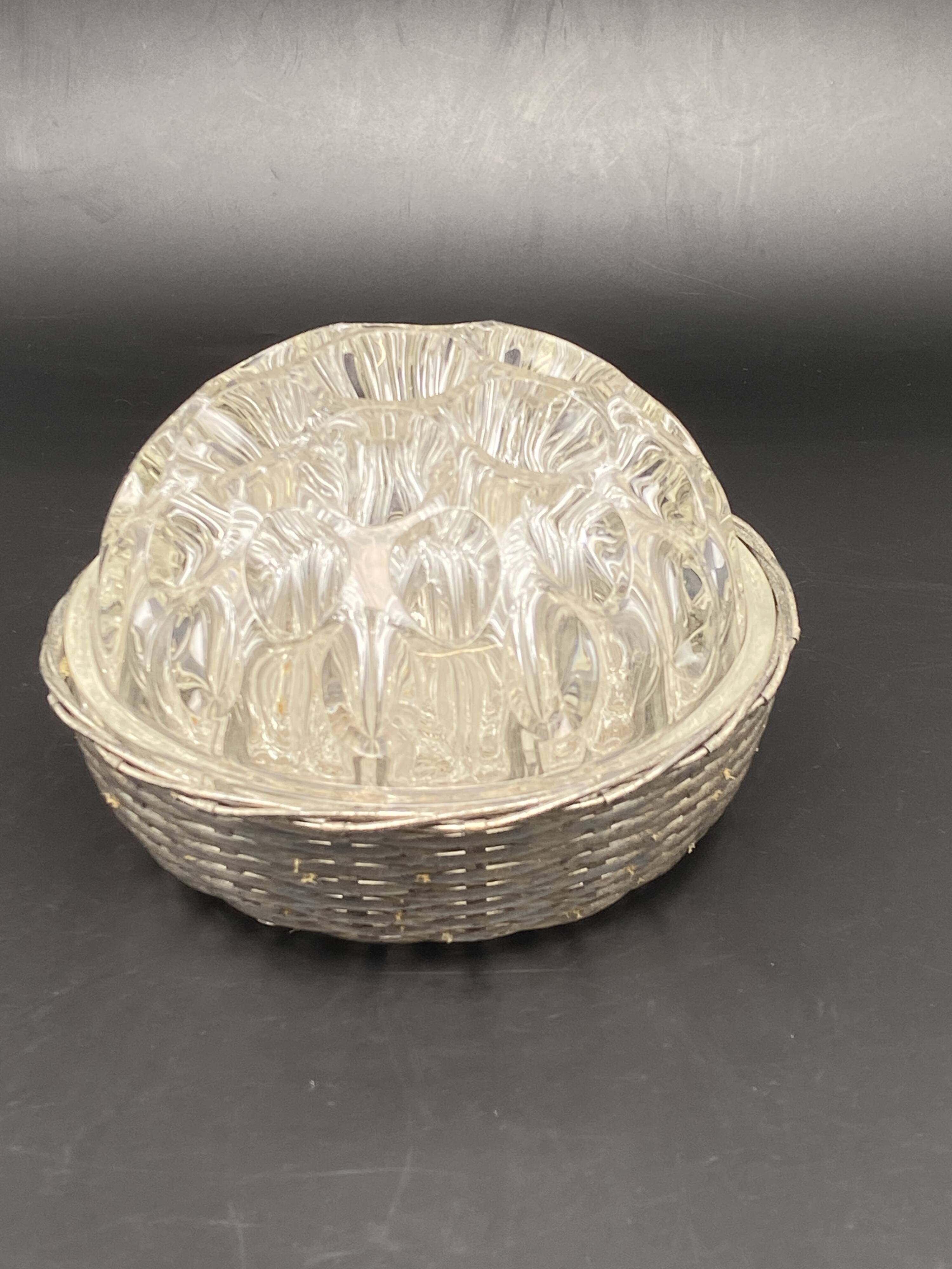 Glass flower stand with woven metal support
