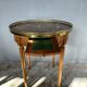 Hot water bottle table with a marble top and a brass gallery.