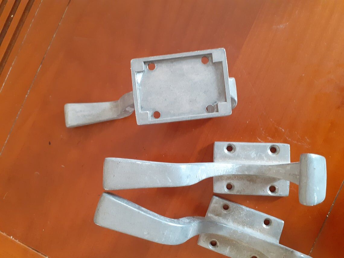 Set of three cast aluminum patères