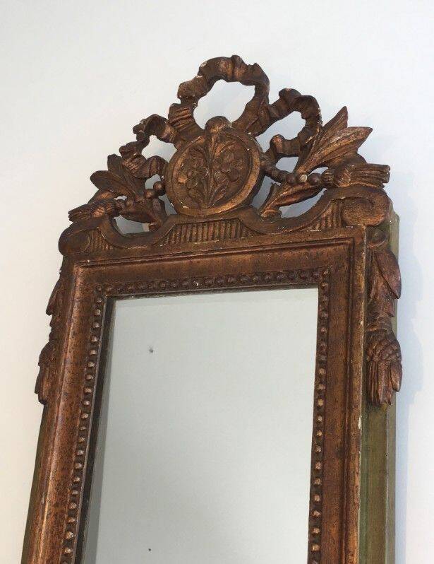 Louis XVI style mirror in patinated and gilded wood