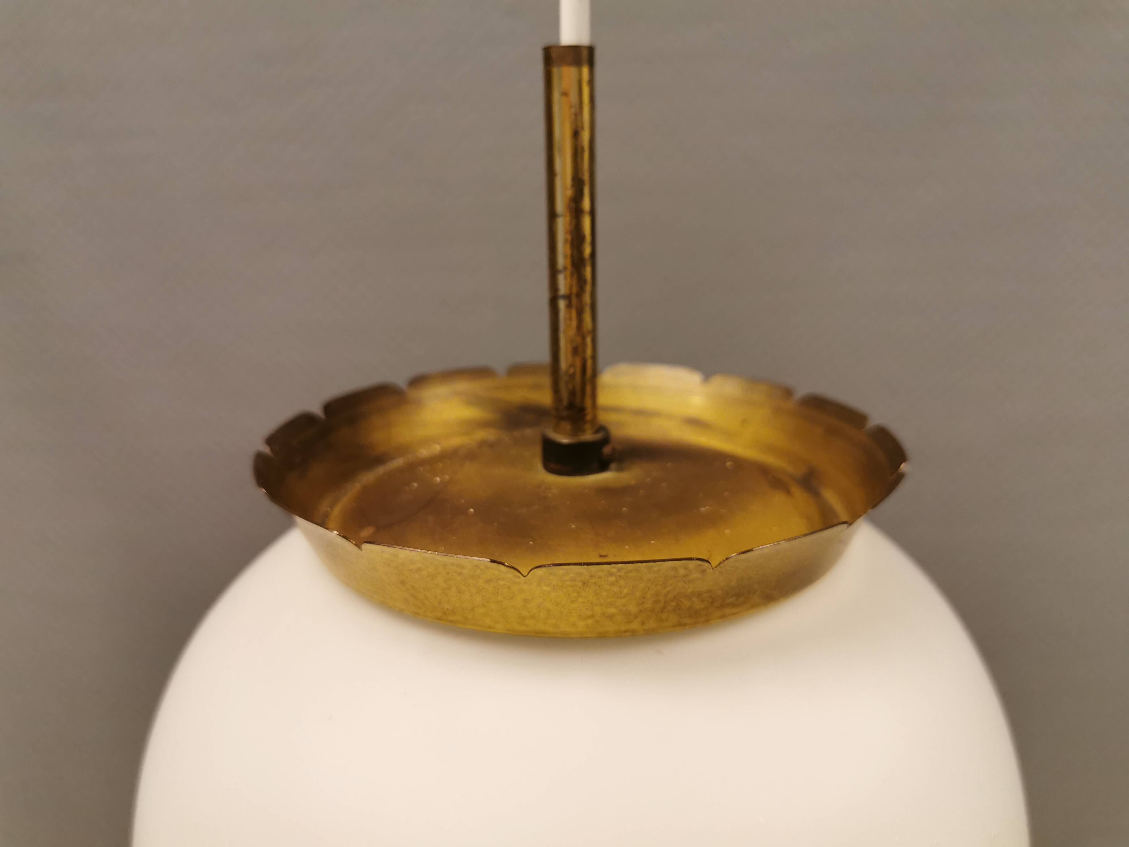 Old hanging lamp in milky white opal glass and brass top/suspension. Danish design 1930s