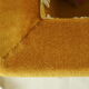 Pouf coffre vintage velours ocre et passementerie
