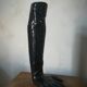 Black earthenware vase gloved hand