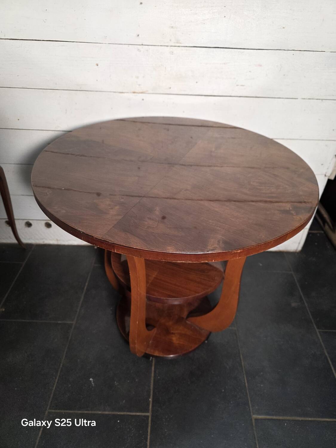 Art Deco walnut gueridon with double top from the 1930s.