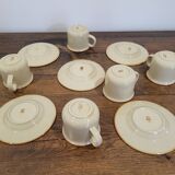 5 enameled stoneware cups and saucers