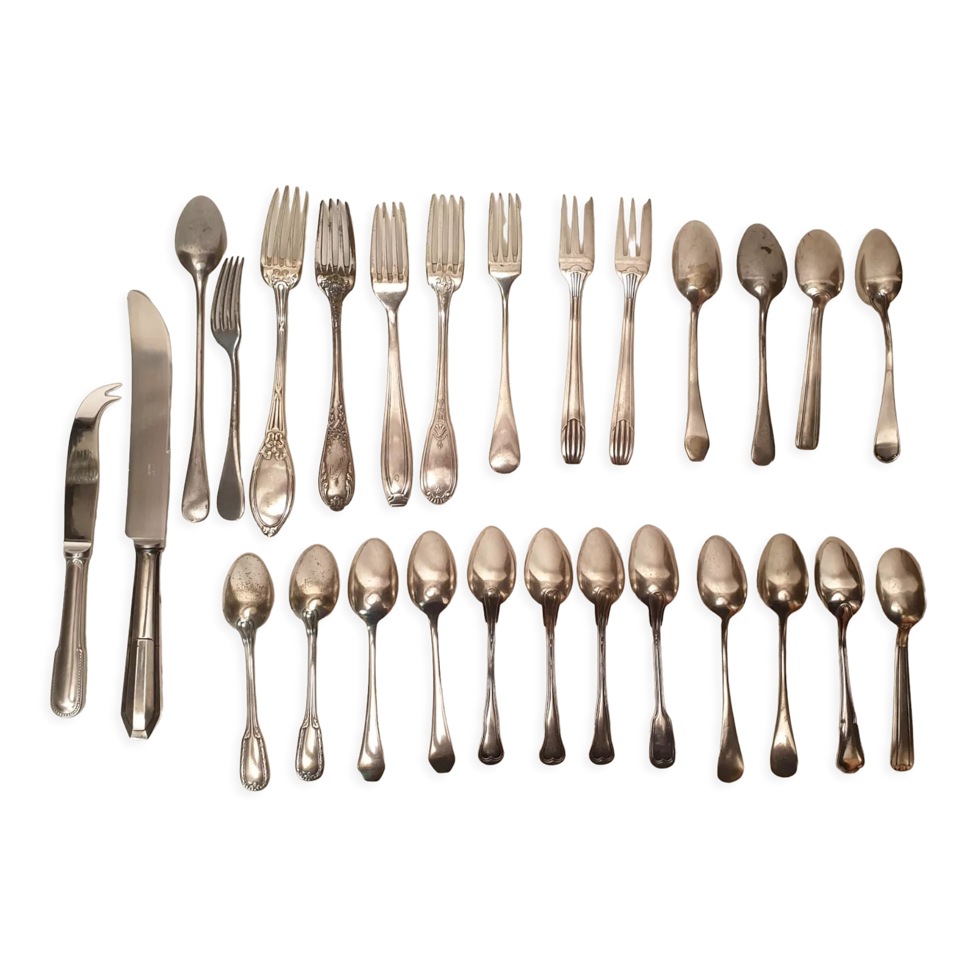 Set of mismatched silvered metal cutlery