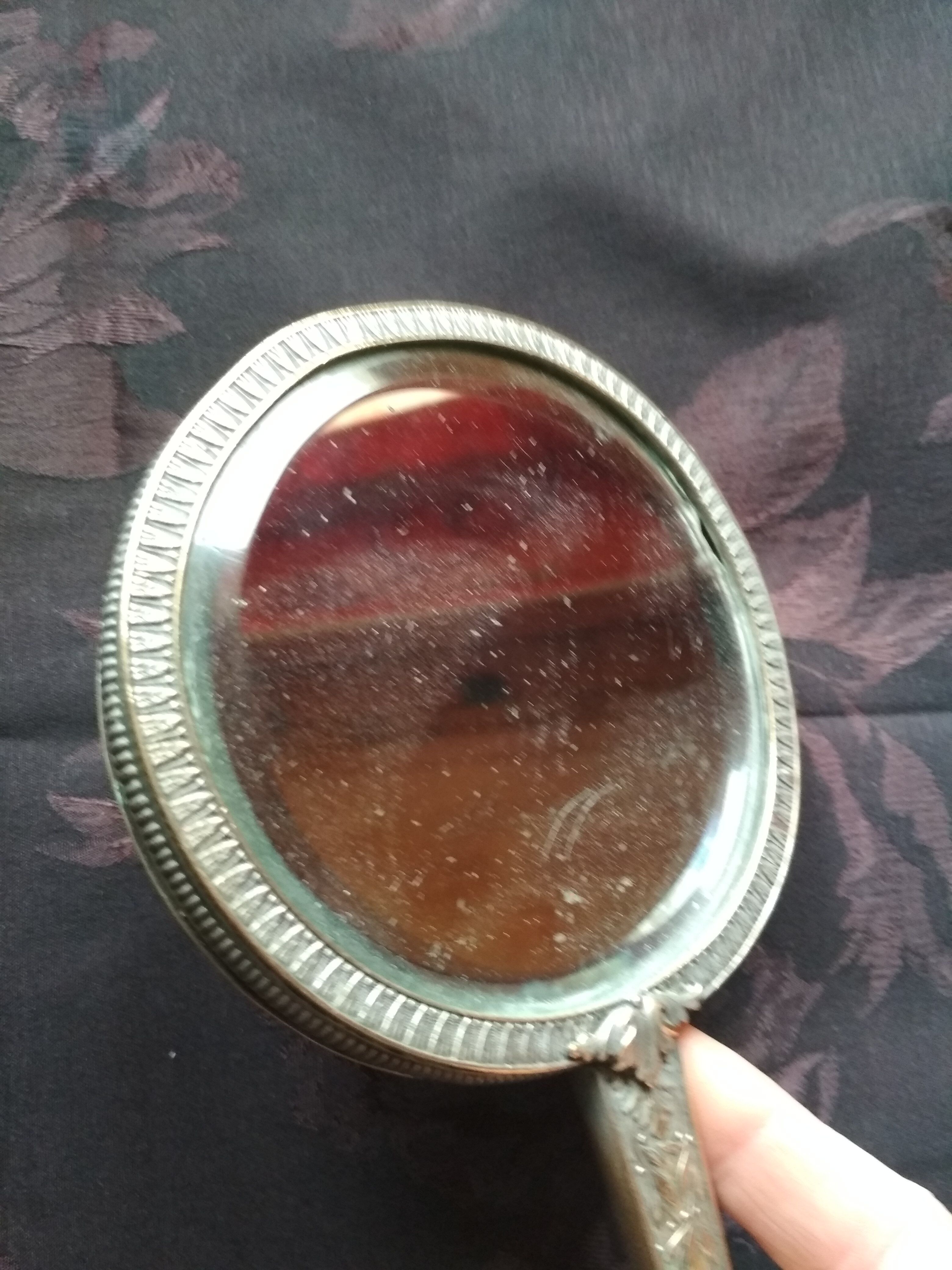 Old hand mirror beveled glass
