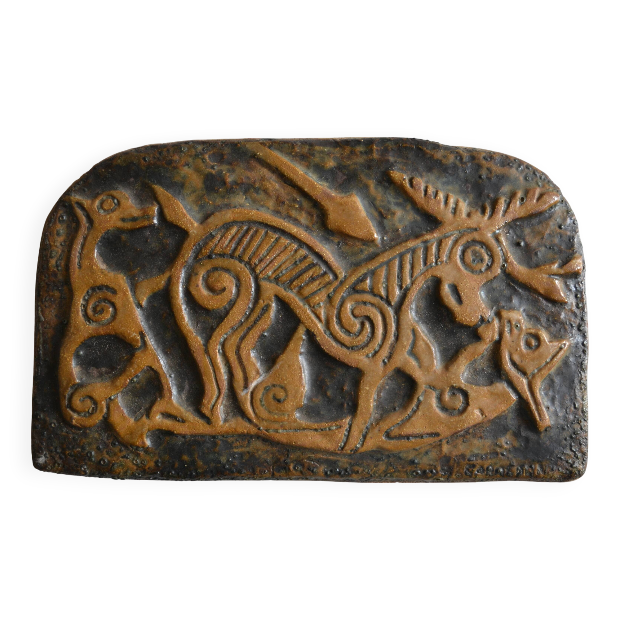 Bas-relief sculpture in terracotta inspired by the Celtic bestiary
