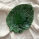 Small empty pocket dish in vintage slip leaf