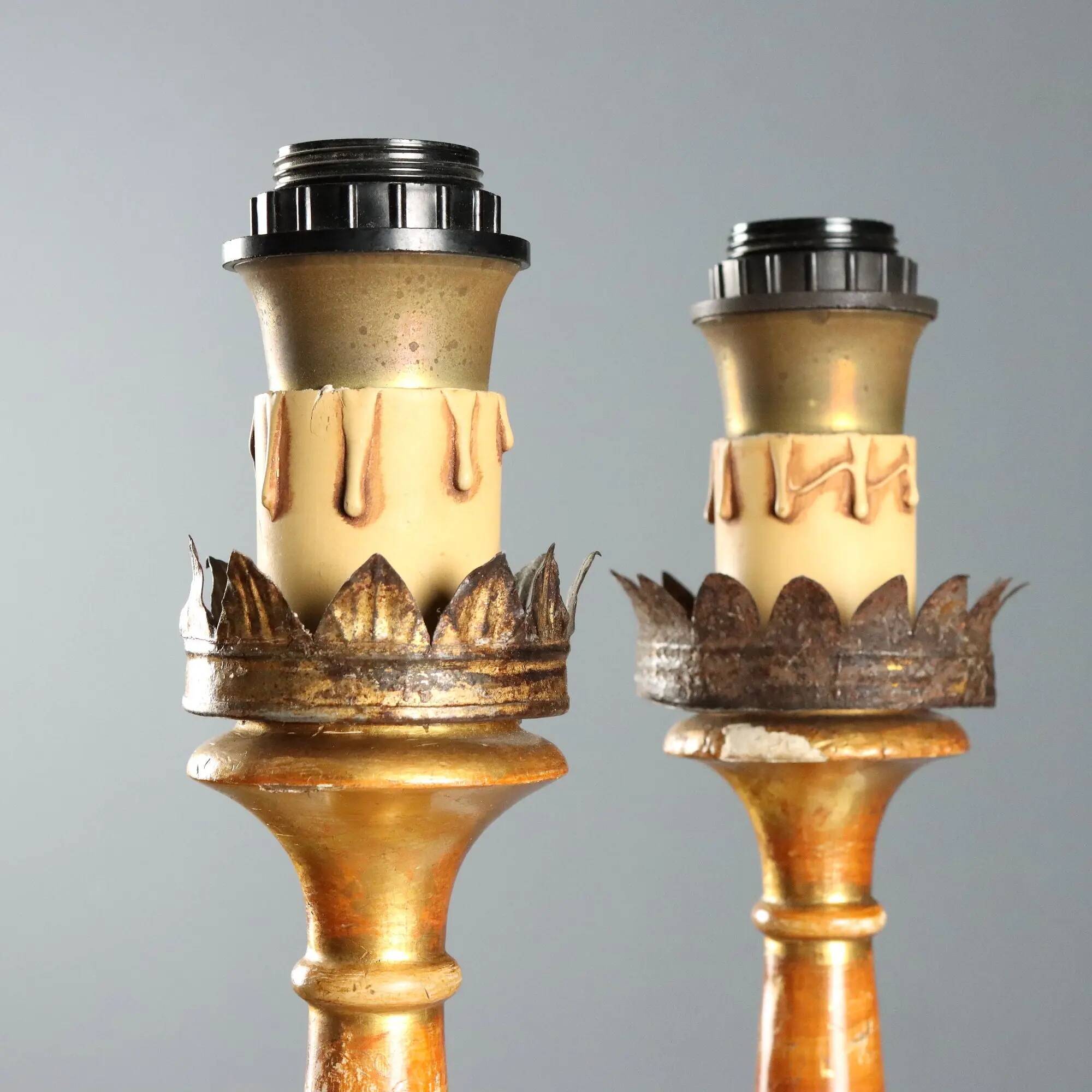 Pair of antique carved and gilded wooden candlesticks, Italy, 19th century.