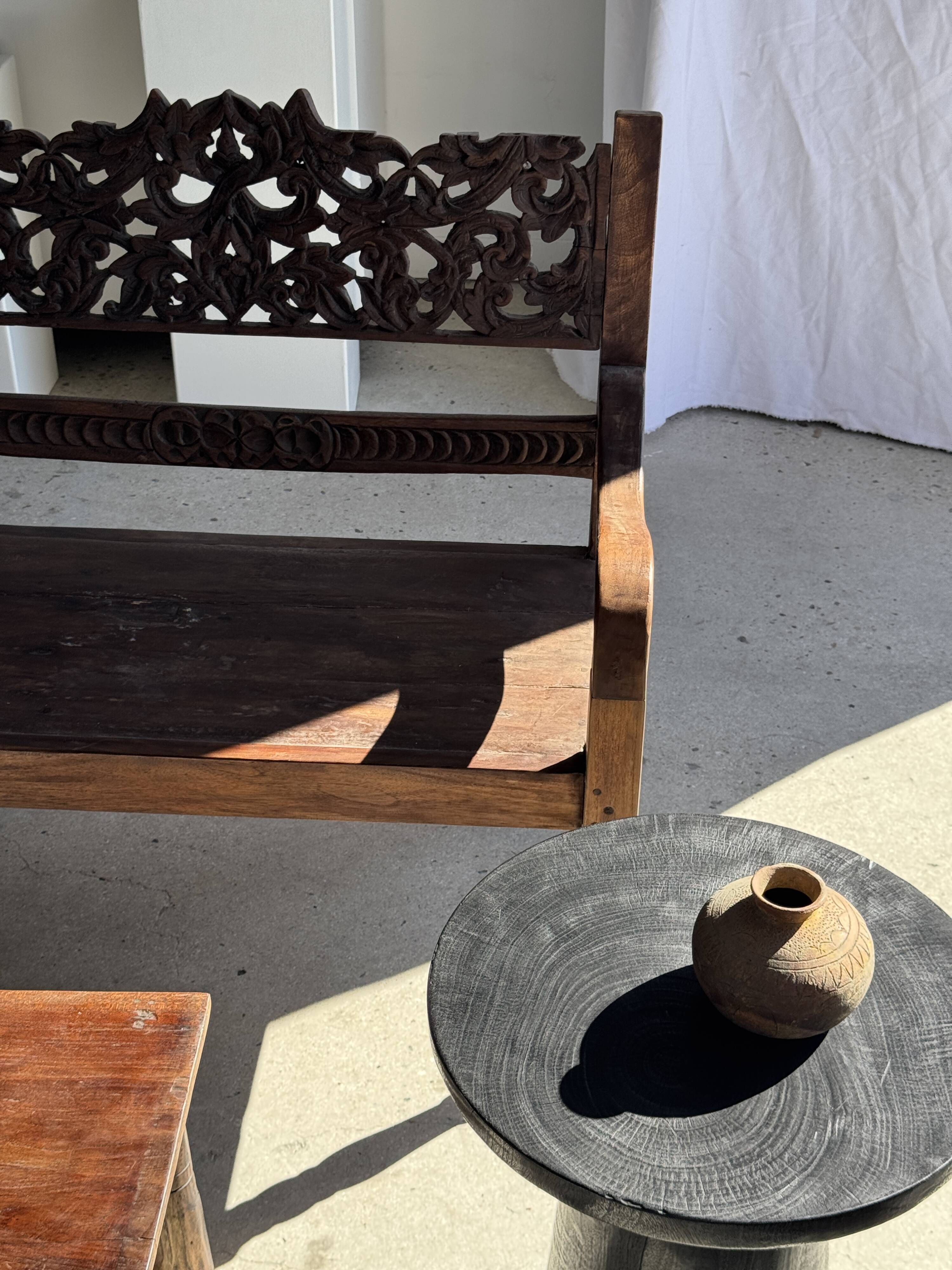 Black solid mango side table (monoxyle) with conical legs