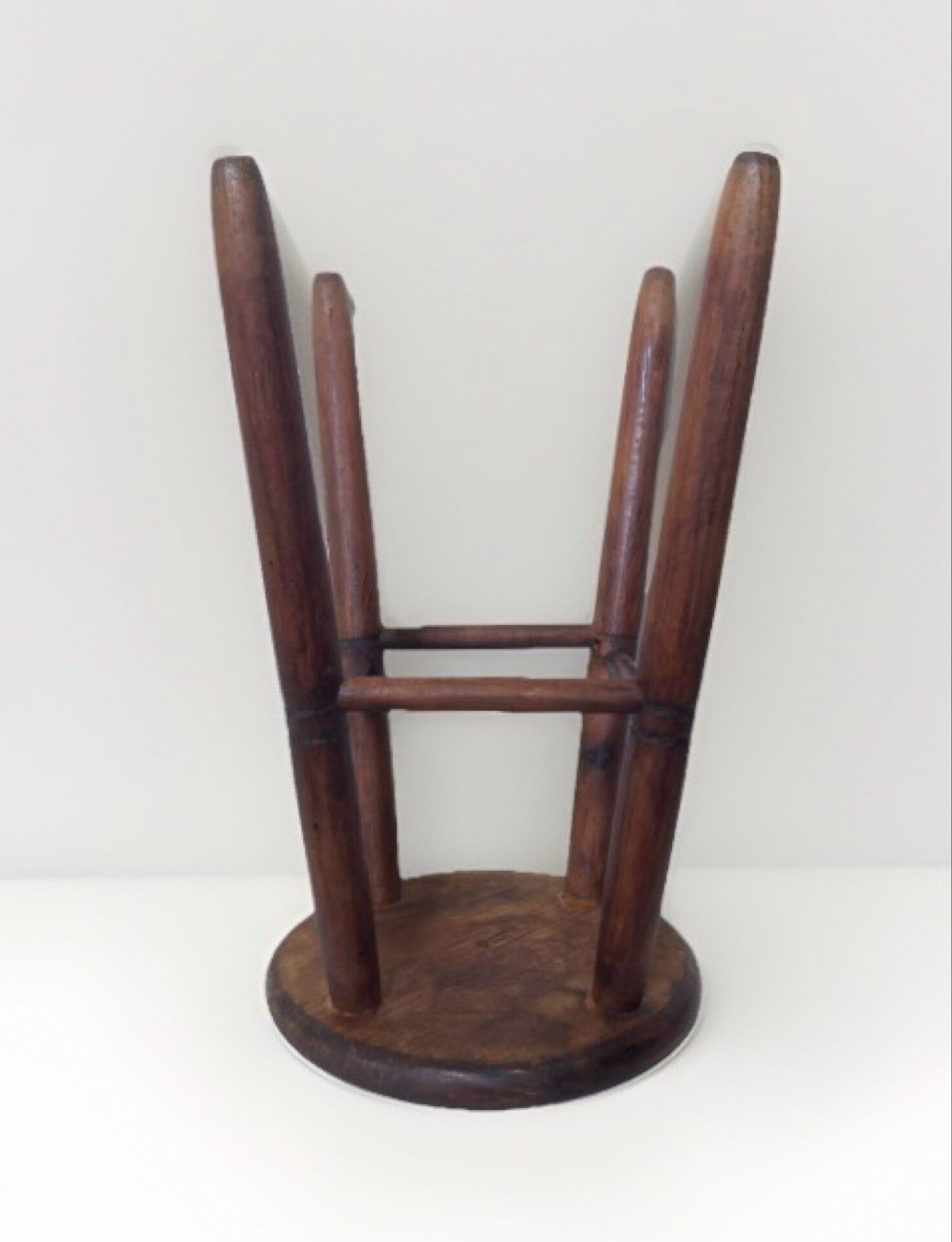 Vintage four-legged stool made of solid wood from the 1970s/80s.