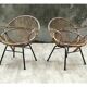 Pair of rattan shell chairs with metallic feet