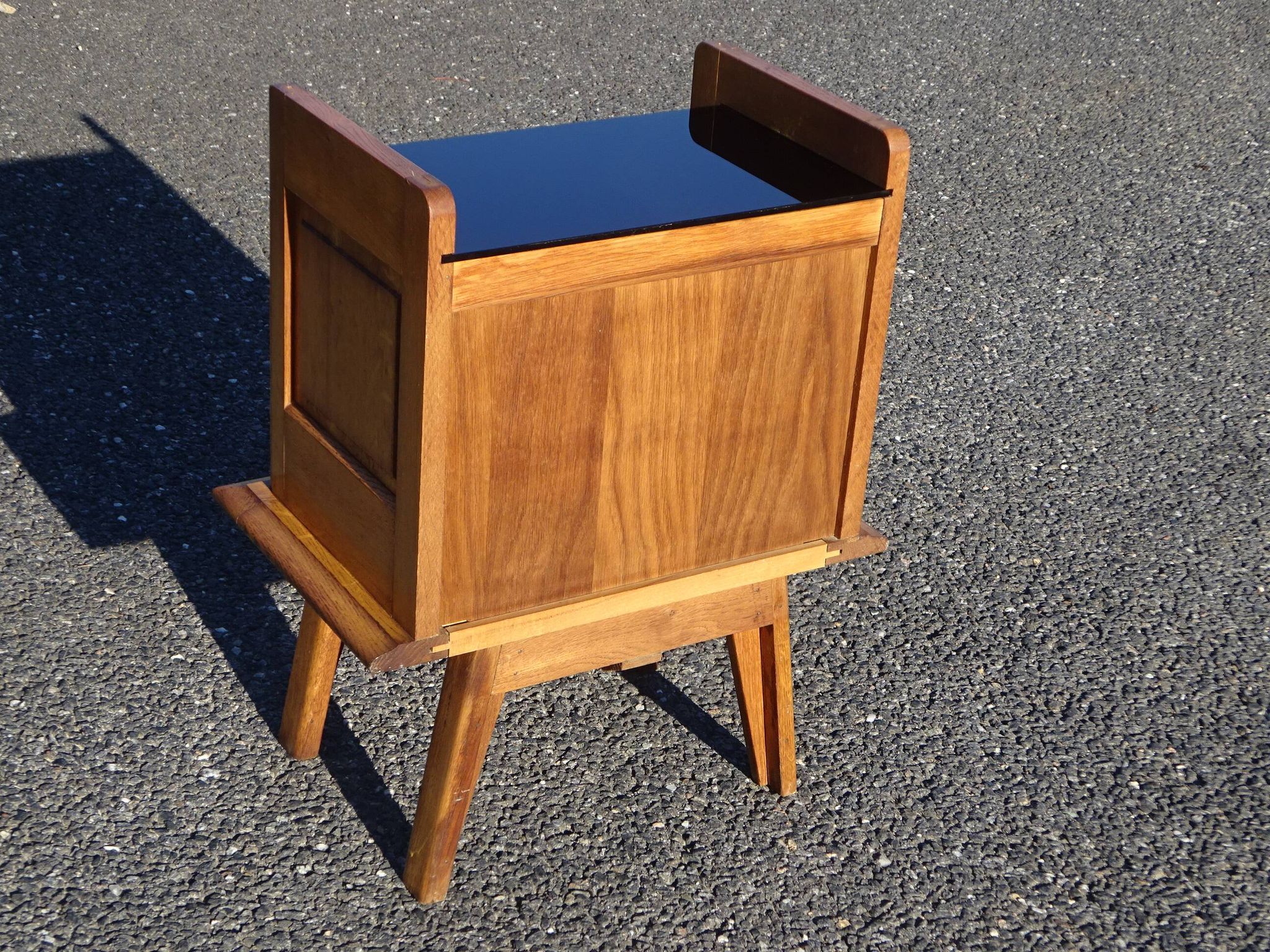 Vintage oak bedside table with tapered legs.