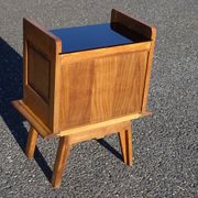 Vintage oak bedside table with tapered legs.