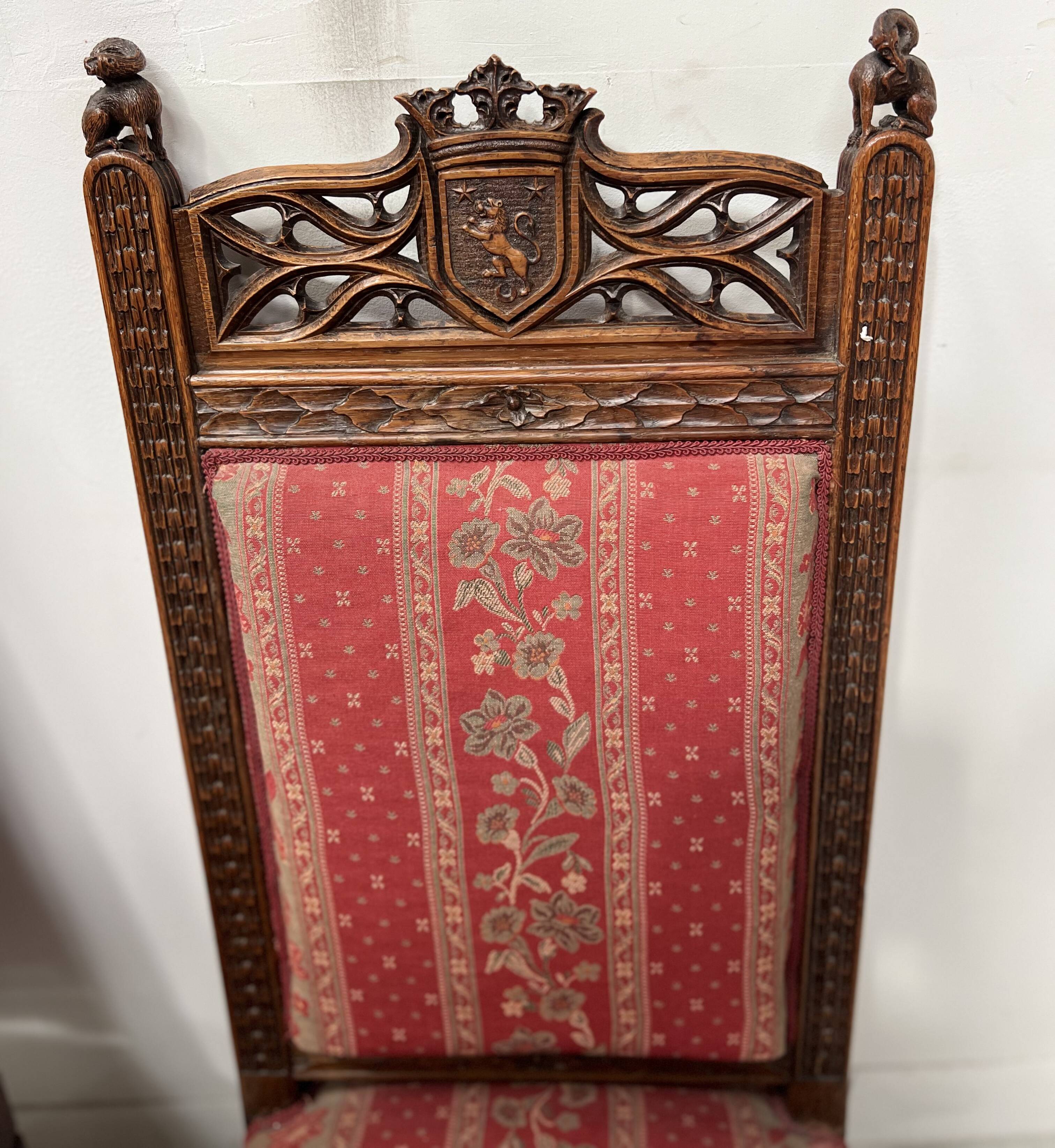 Pair of Gothic-style walnut lounge chairs, 19th century