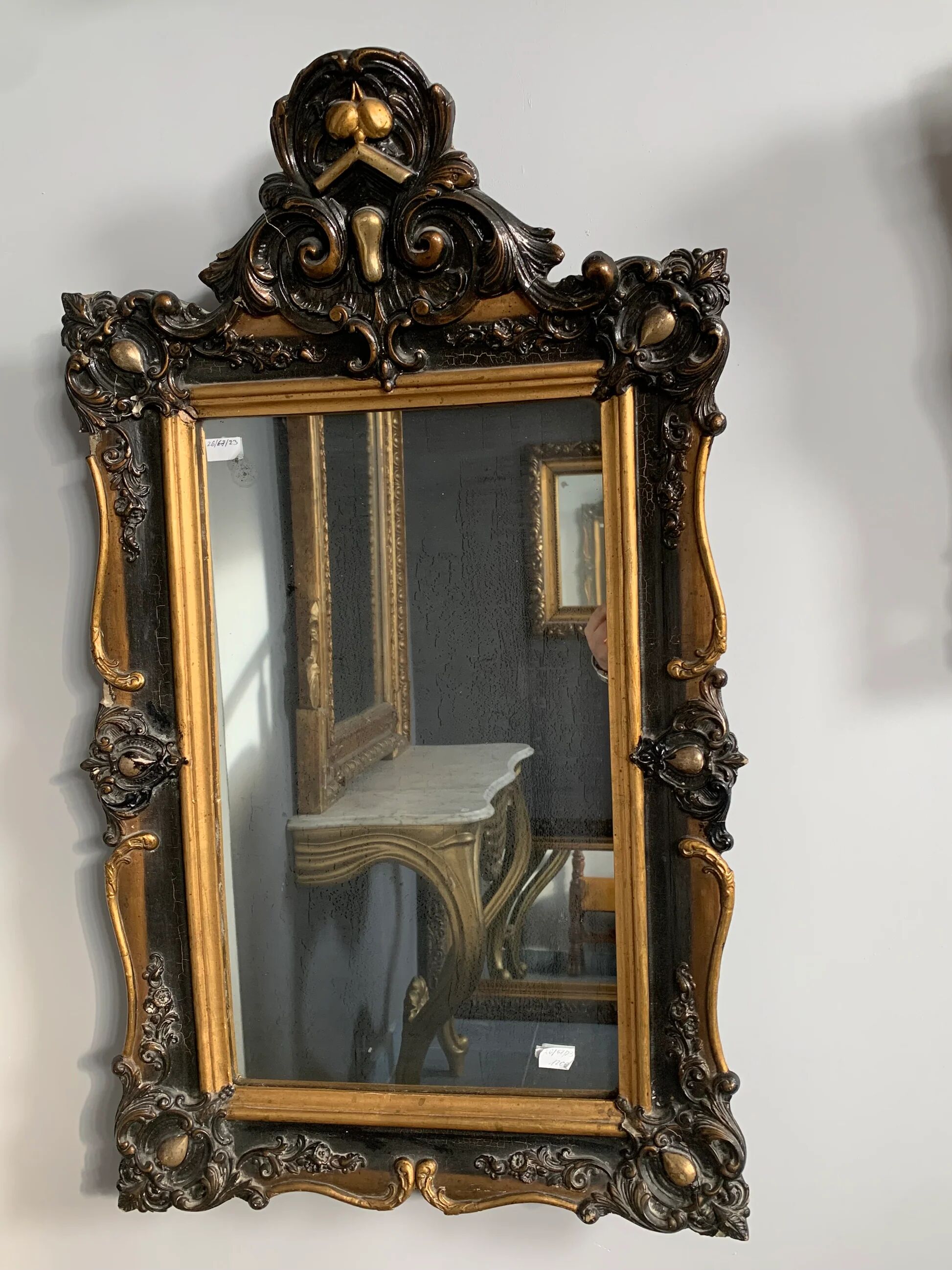 Antique bevelled mirror from the 19th century, sculpted and gilded frame.