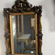 Antique bevelled mirror from the 19th century, sculpted and gilded frame.