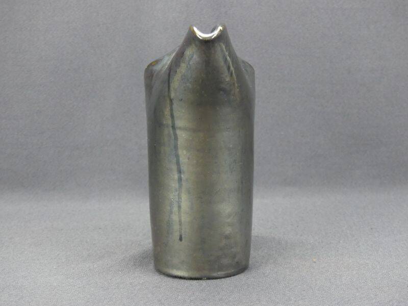 Old Biot, modernist pitcher in iridescent black ceramic.