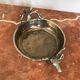 Empty silver metal pocket with deer heads