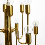 Three staged 18 arm Mid Century brass chandelier with a long brass rod