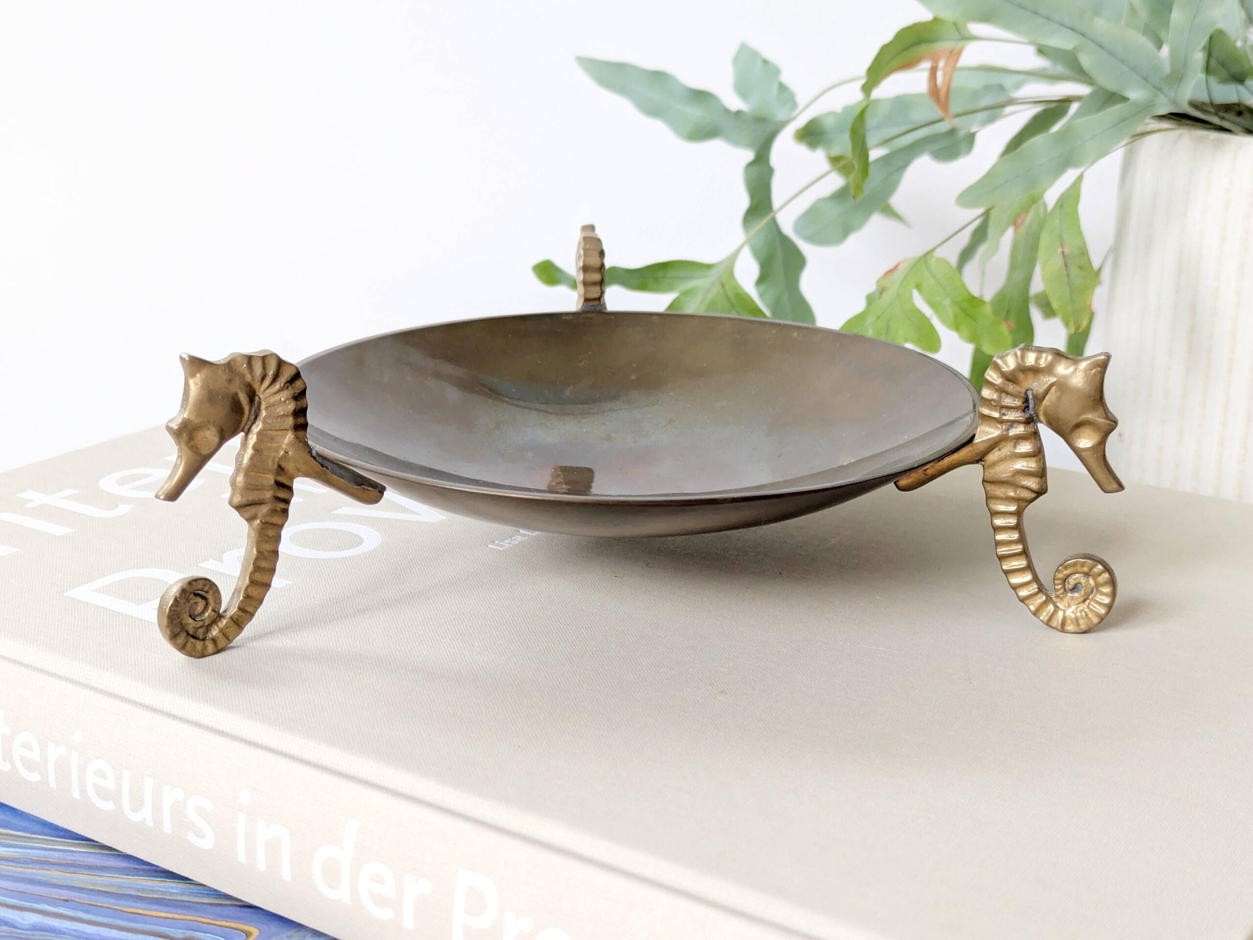 Vintage round brass tray on seahorse feet