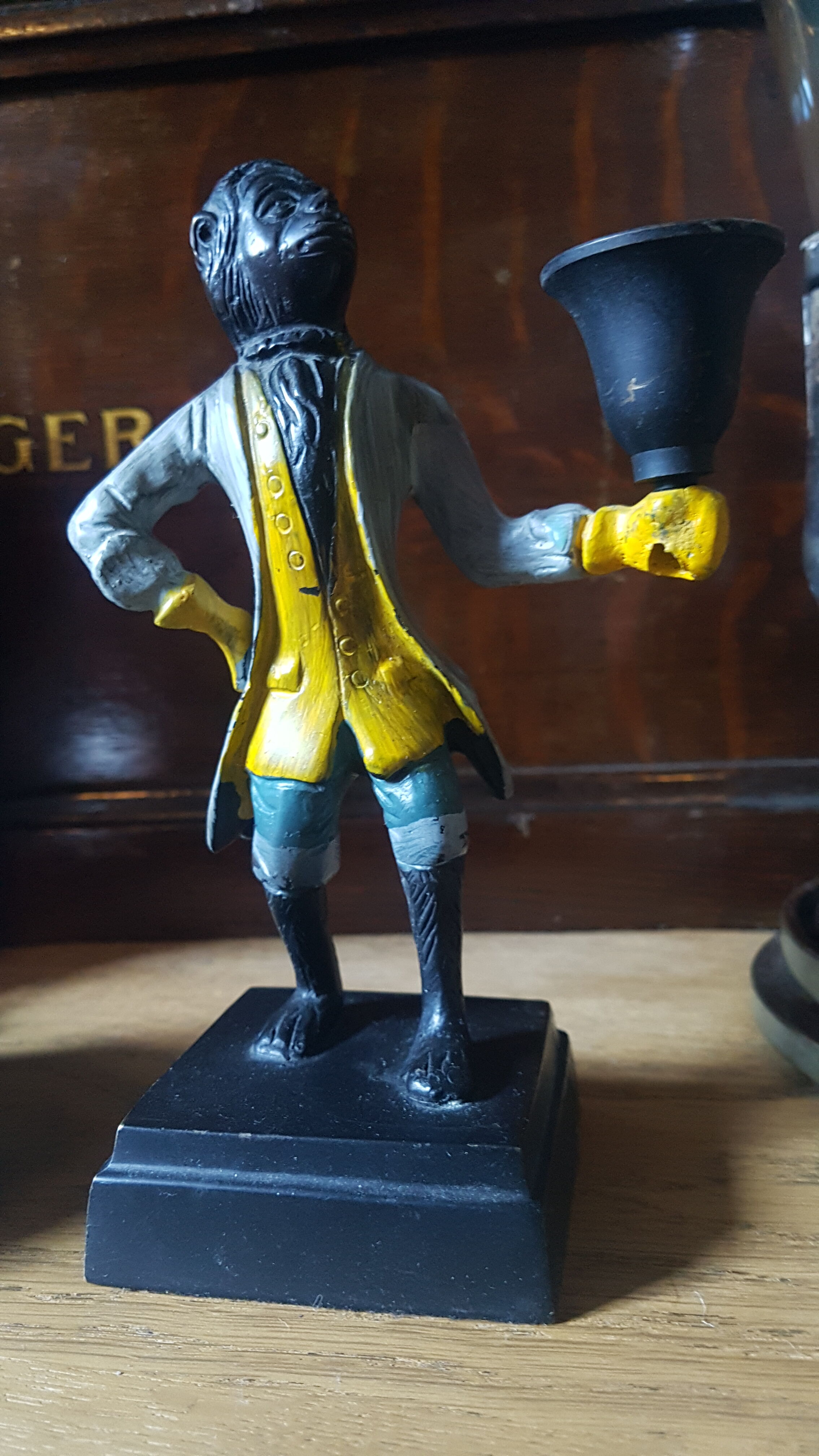 Cast iron servant monkey candle holder