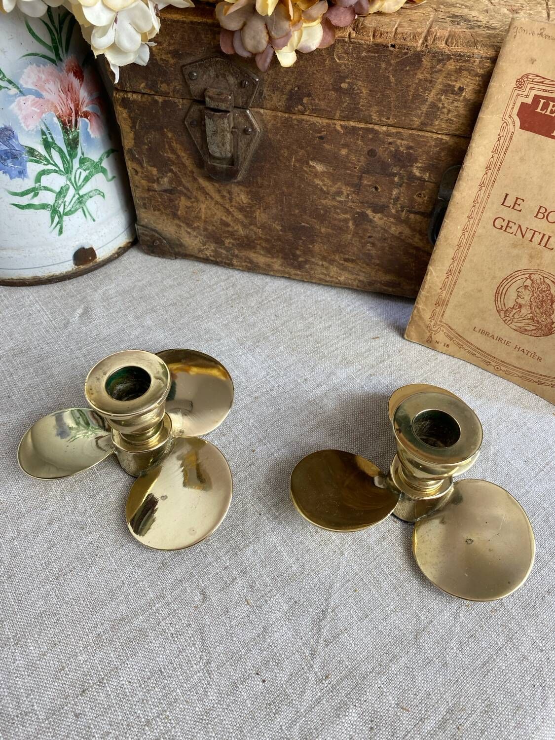 Pair of vintage brass propeller-shaped candlesticks
