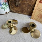 Pair of vintage brass propeller-shaped candlesticks