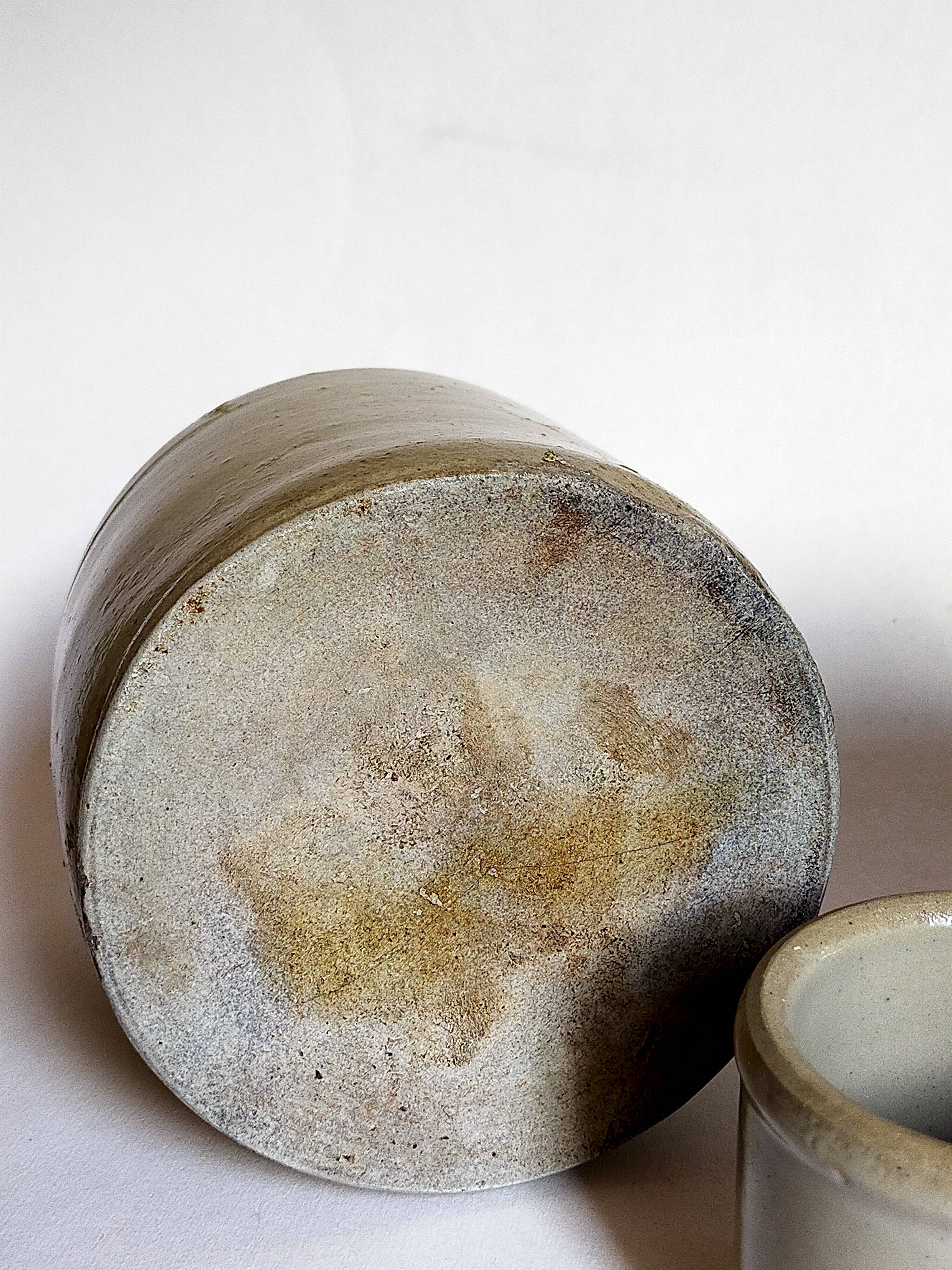 Set of three pots with old condiments in glazed earth