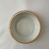 White and golden pill box with a blue bird