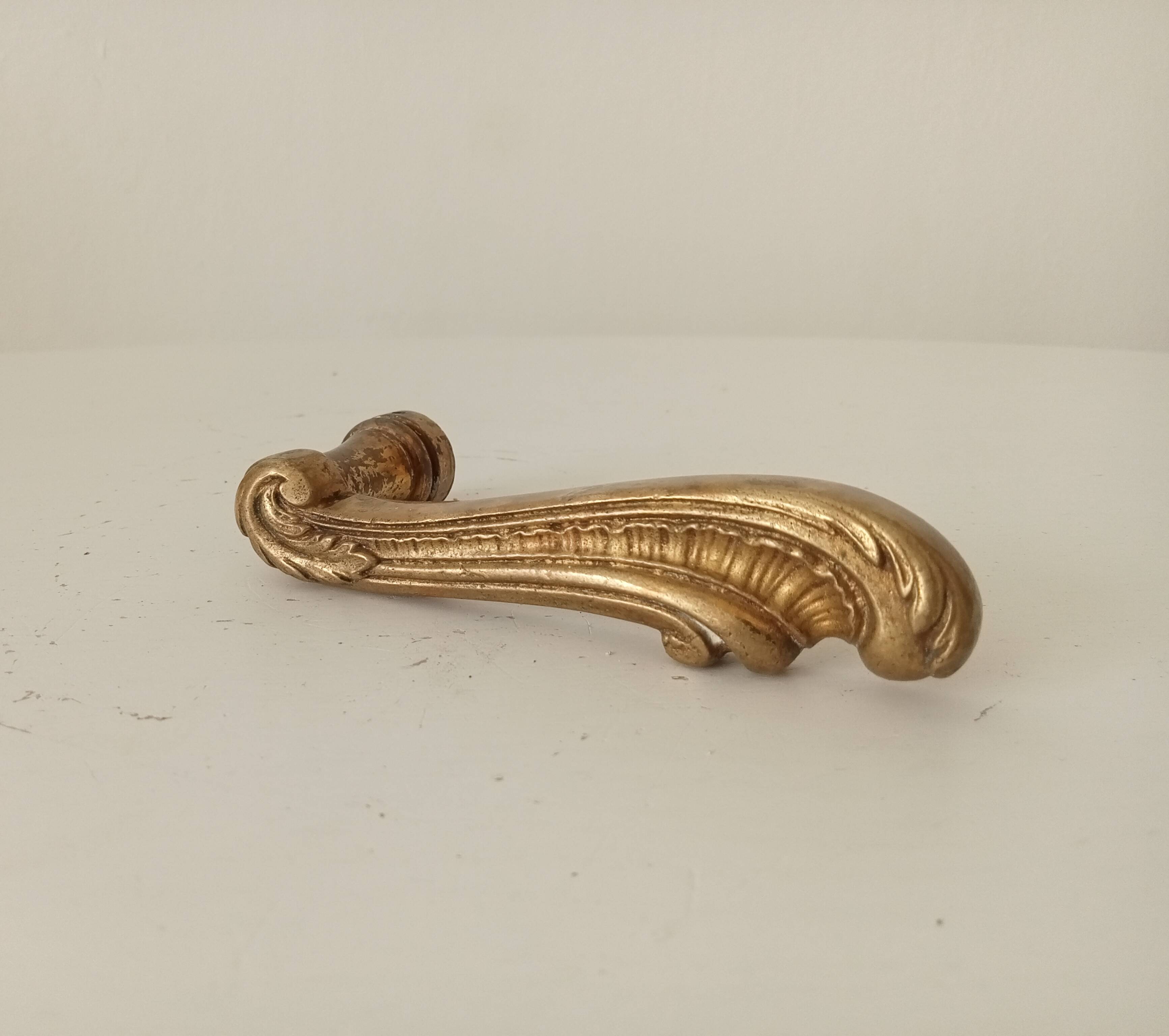 Antique bronze door handle in Empire style